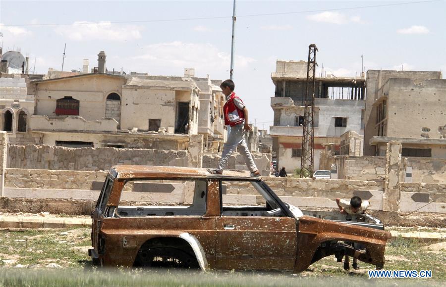 SYRIA-HOMS-REBELS-EVACUATION